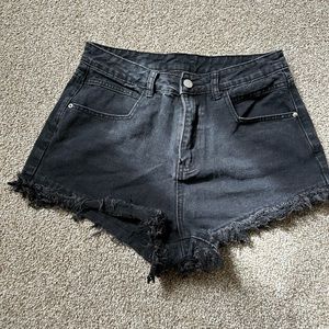 Lightly distressed black denim shorts